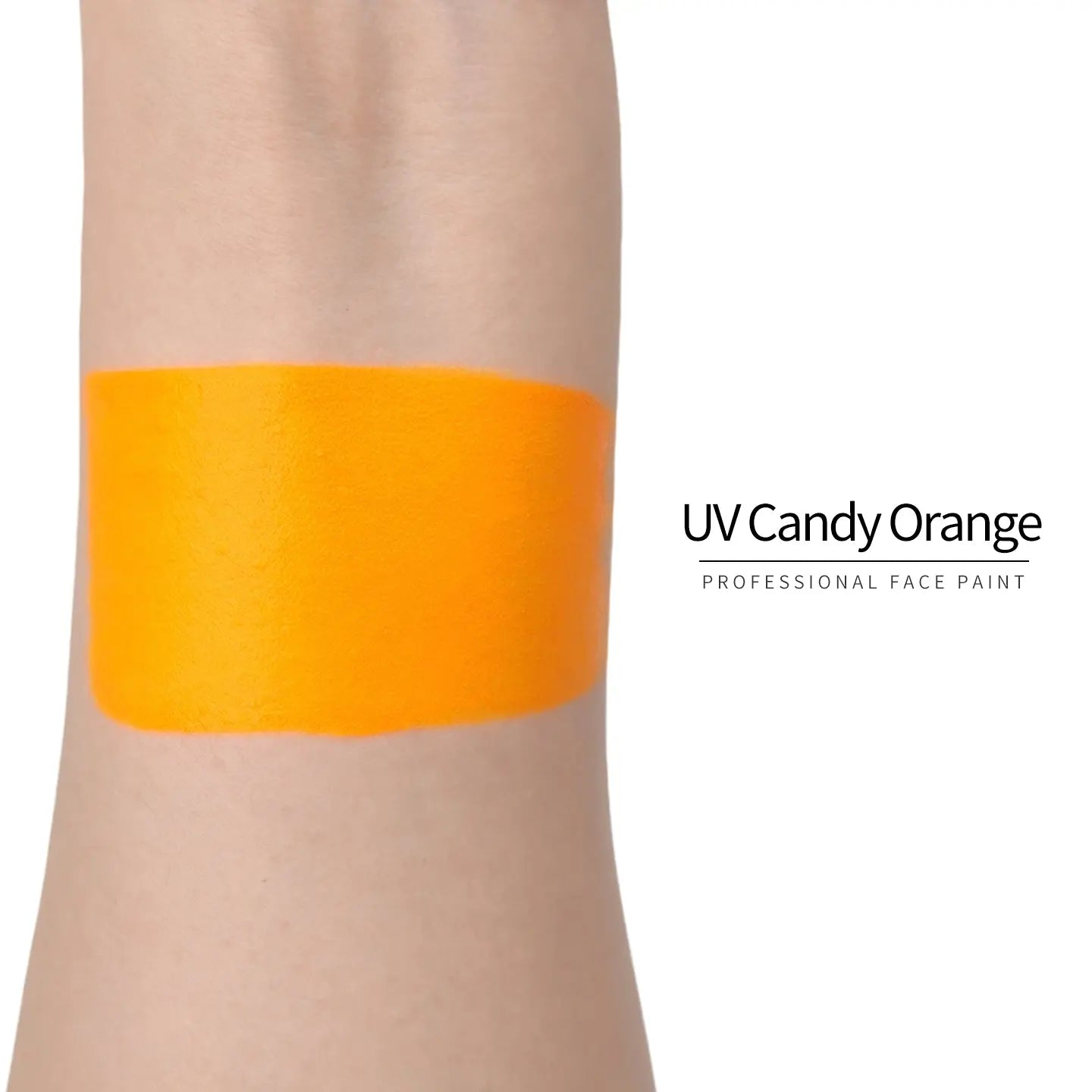 Anka Bella UV Candy Orange face paint arm swatch, bright neon candy orange UV glow body paint sample on skin