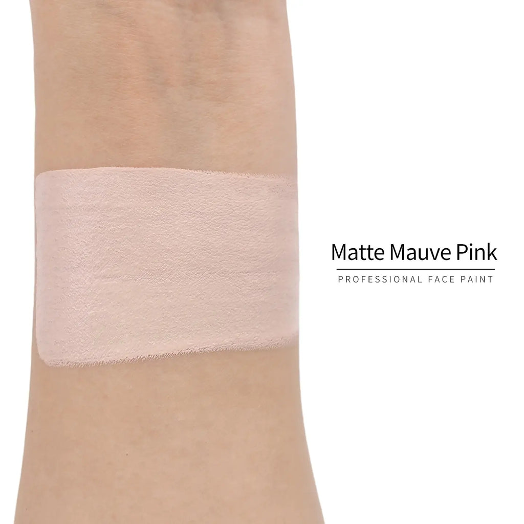 Matte mauve pink face paint swatch on arm, high pigment water based body art makeup