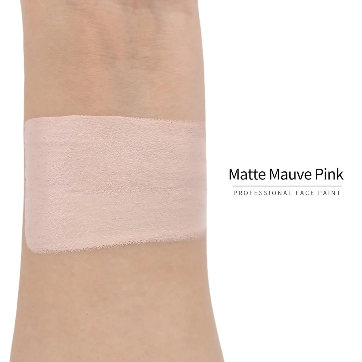 Matte mauve pink face paint swatch on arm, high pigment water based body art makeup