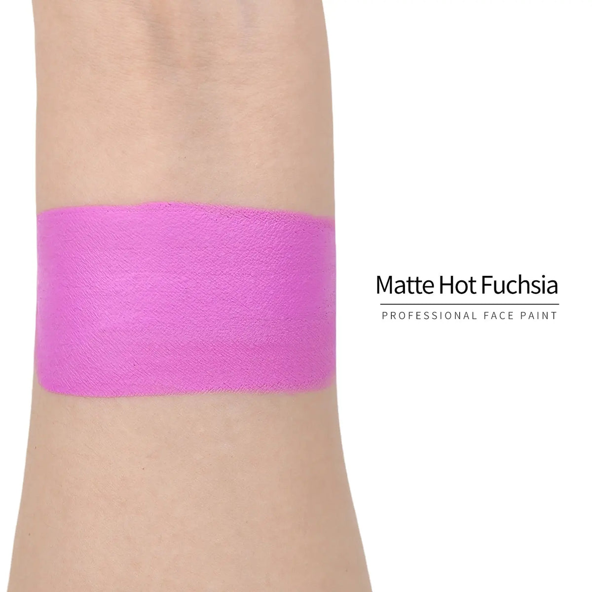 Matte hot fuchsia face paint swatch on arm, high pigment water based body art makeup