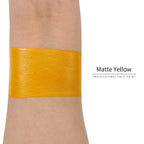 Matte yellow face paint swatch on arm, high pigment water based body art makeup