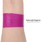 Matte light magenta face paint swatch on arm, high pigment water based body art makeup
