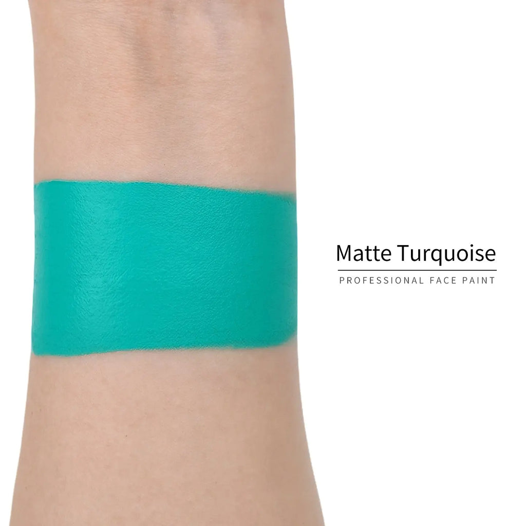 Matte turquoise face paint swatch on arm, high pigment water based body art makeup