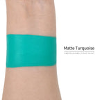 Matte turquoise face paint swatch on arm, high pigment water based body art makeup