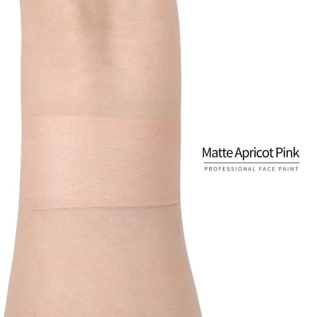 Anka Bella Matte Apricot Pink face paint arm swatch, soft warm apricot‑pink matte body paint sample on skin