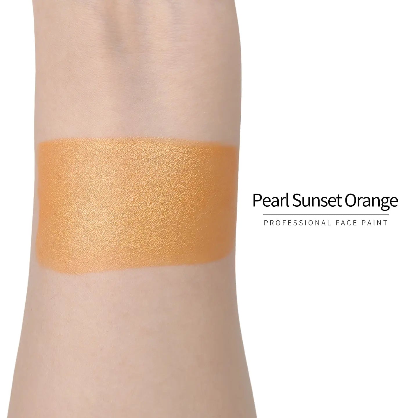 Anka Bella Pearl Sunset‑Orange face paint arm swatch, warm shimmer sunset‑orange pearl body paint sample on skin