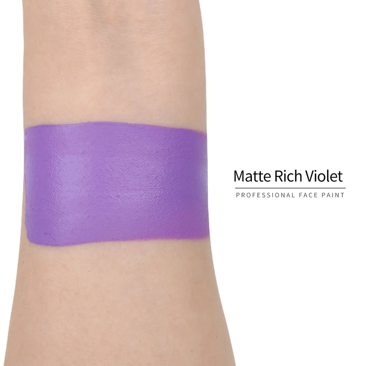 Matte rich violet face paint swatch on arm, high pigment water based body art makeup