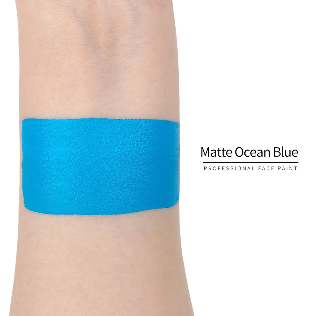 Anka Bella Matte Ocean Blue face paint arm swatch, vivid bright ocean blue matte body paint sample on skin