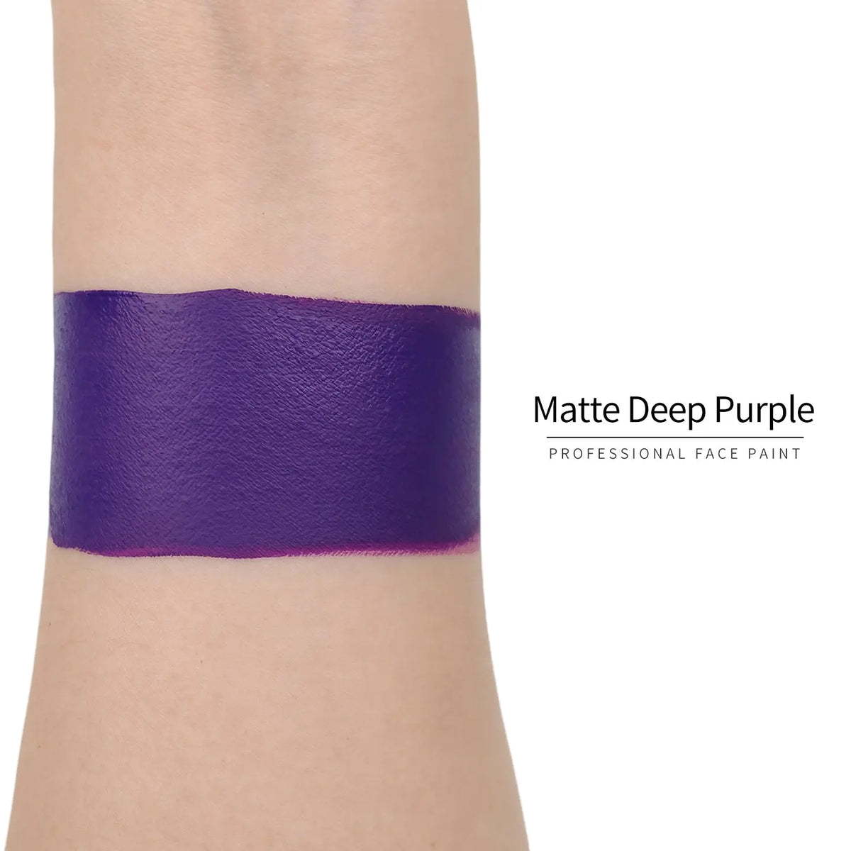 Matte deep purple face paint swatch on arm, high pigment water based body art makeup
