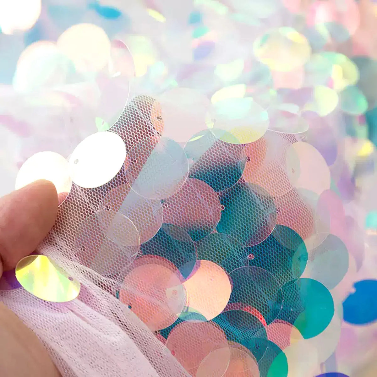 Anka Bella holographic sequin tablecloth close-up, shiny iridescent mermaid scale fabric, protective mat for face paint palettes and brushes