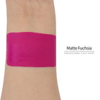 Matte fuchsia face paint swatch on arm, high pigment water based body art makeup