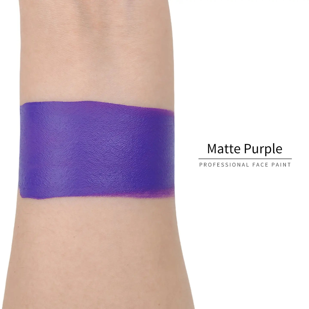 Matte purple face paint swatch on arm, high pigment water based body art makeup
