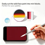 Cut Anka Bella solid matte burgundy face paint into mini blocks to build custom DIY split‑cake face paint palette