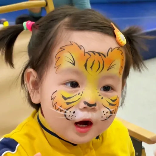 Yellow and orange round cake face paint ankabellaFace painting, Anka bella